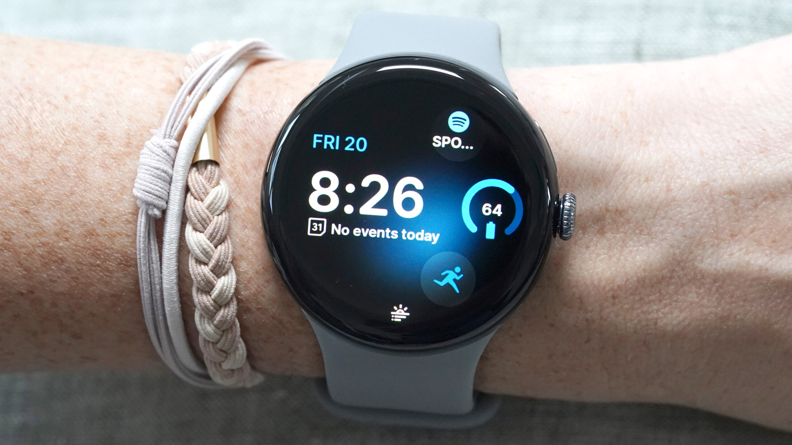 The Google Pixel Watch 3 shows a watch face with the Morning Brief Notification at the bottom.